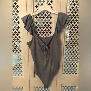 Light blue ribbed bodysuit with ruffle straps from Cider